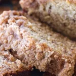 Slice of Coffee Cake Banana Bread on a plate with coffee