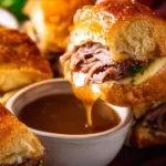 Delicious French Dip Sliders served with au jus for dipping.