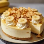 Delicious Banana Pudding Crunch Cheesecake topped with crispy crust and bananas