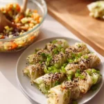 Plate of homemade cabbage dumplings, steamed to perfection and garnished.