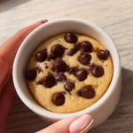 Delicious microwave chocolate chip mug cookie topped with chocolate chips
