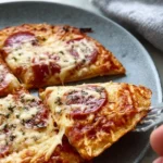 Delicious Pizza Eggs served on a plate, combining pizza flavors with scrambled eggs.