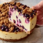 Delicious homemade blueberry cheesecake topped with fresh blueberries