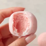 Strawberry mochi dessert featuring fresh strawberries and a chewy rice dough.