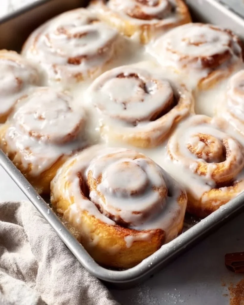 Delicious homemade cinnamon rolls topped with creamy icing