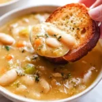 Delicious bowl of homemade Butter Bean Soup topped with fresh herbs