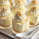 No-bake lemon cheesecake mousse cups served in elegant dessert cups
