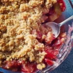 Delicious old-fashioned rhubarb crumble with a golden crispy topping