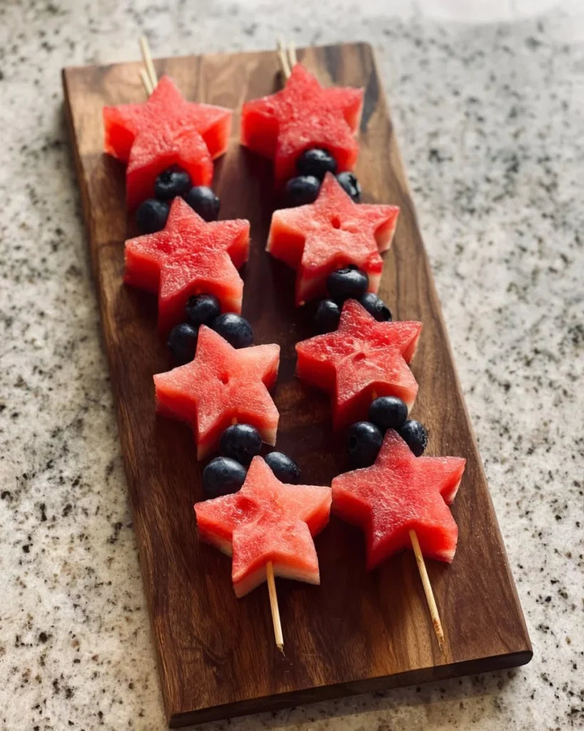 Star-Spangled fruit skewers with strawberries, blueberries, and bananas.