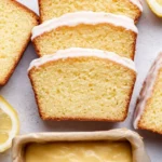 Homemade Starbucks copycat lemon loaf served with a slice cut out