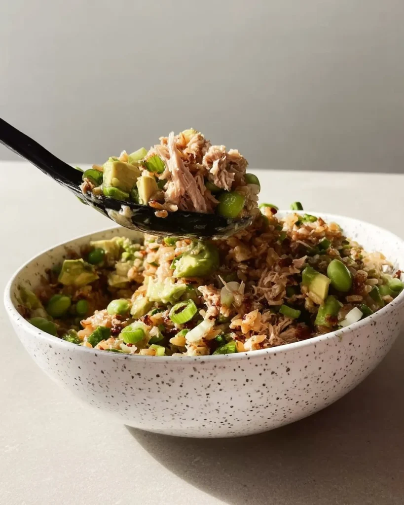 Tuna Avocado Salad served on crispy rice, garnished for a fresh and flavorful meal